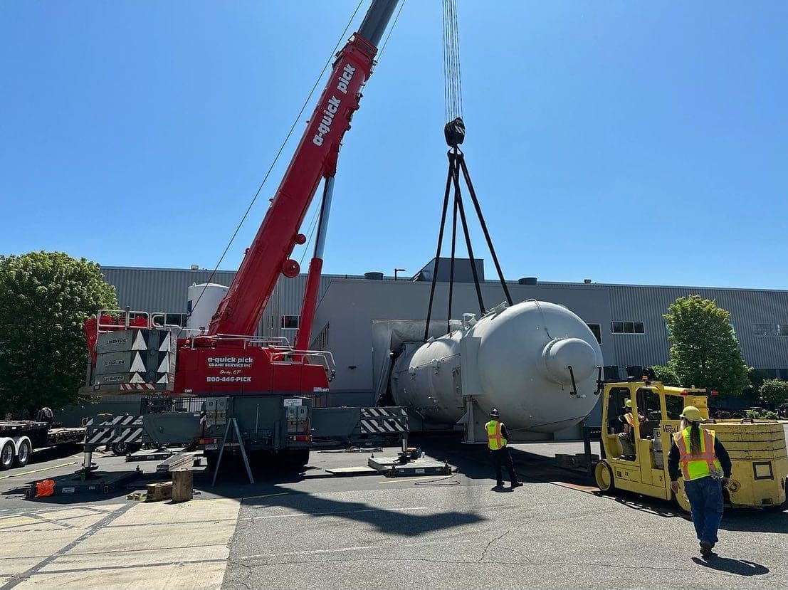 Quick Pick crane operating on construction jobsite