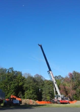 Hoisting Precast Sewage System for Holy S#%& in Wilton, CT