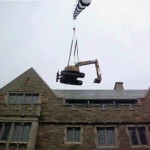 Excavator Over Buiding with Crane